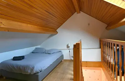 Un ou plusieurs lits dans un hébergement de l'établissement La Petite Maison Blanzy