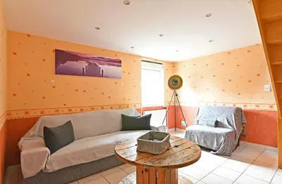 Coin salon dans l'établissement La Petite Maison Blanzy
