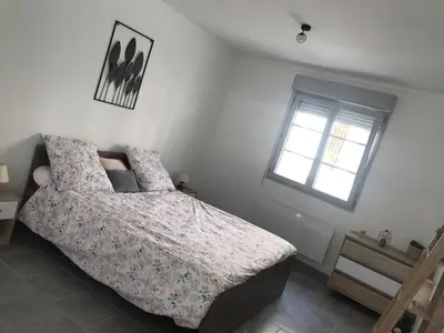 Un ou plusieurs lits dans un hébergement de l'établissement Appartement Dulac