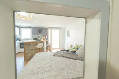 Un ou plusieurs lits dans un hébergement de l'établissement Le Flav - Charmant appartement à 10 mn de Dijon