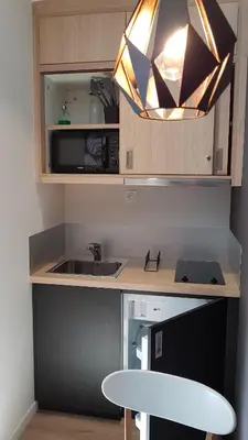 Cuisine ou kitchenette dans l'établissement Appart Hotel Montchapet Dijon Centre