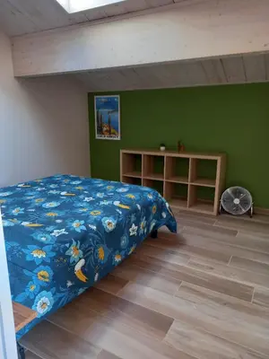 Un ou plusieurs lits dans un hébergement de l'établissement Gîte Mamie Cocotte