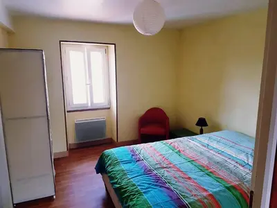 Un ou plusieurs lits dans un hébergement de l'établissement Gîte cosy 4 à 9 personnes