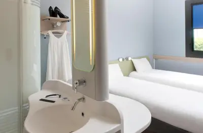 Un ou plusieurs lits dans un hébergement de l'établissement ibis budget Montceau les Mines