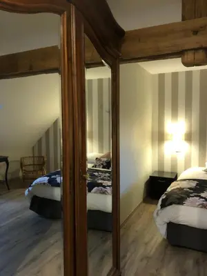 Un ou plusieurs lits dans un hébergement de l'établissement Gîte Le Domaine d Orphée