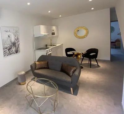 Coin salon dans l'établissement Le Nid du Faubourg
