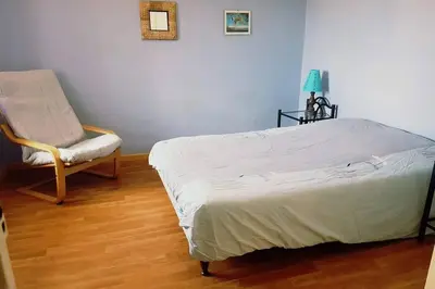Un ou plusieurs lits dans un hébergement de l'établissement Gîte cosy 2 à 5 personnes