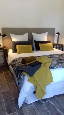Un ou plusieurs lits dans un hébergement de l'établissement B&B au Moulin de Riottier
