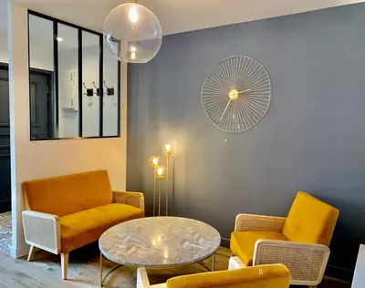Coin salon dans l'établissement Les Trois B - Hypercentre de Beaune