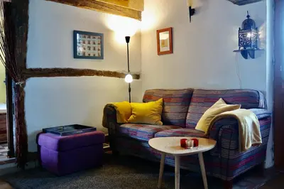 Coin salon dans l'établissement gîte Aux Petits Bonheurs avec vue panoramique