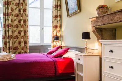 Un ou plusieurs lits dans un hébergement de l'établissement Appartement - Petit Buffon