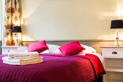 Un ou plusieurs lits dans un hébergement de l'établissement Appartement - Petit Buffon