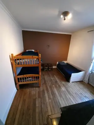 Un ou plusieurs lits dans un hébergement de l'établissement Joli appartement meublé