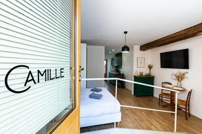 Un ou plusieurs lits dans un hébergement de l'établissement La Maison George