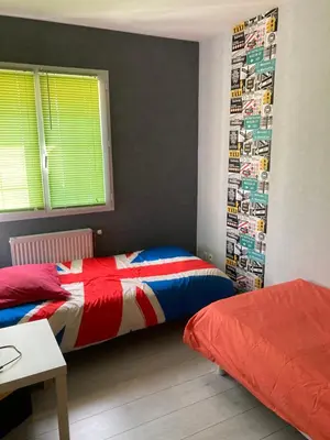 Un ou plusieurs lits dans un hébergement de l'établissement BEAUN'MAISON Spa Piscine Borne électrique