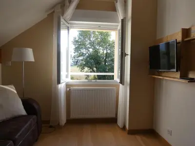 Télévision ou salle de divertissement dans l'établissement les iris