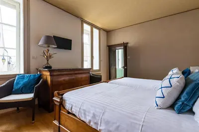 Un ou plusieurs lits dans un hébergement de l'établissement Chez Camille