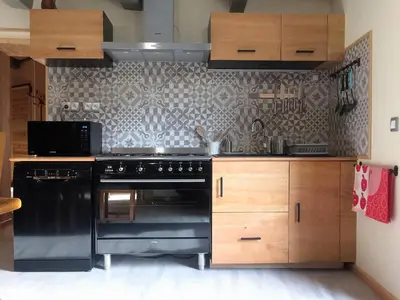 Cuisine ou kitchenette dans l'établissement Les Billardes - le gite - Jura