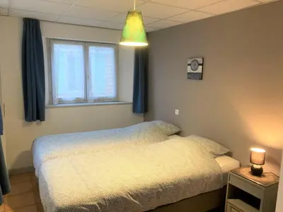 Un ou plusieurs lits dans un hébergement de l'établissement Appartement 