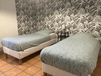 Un ou plusieurs lits dans un hébergement de l'établissement Appartement 