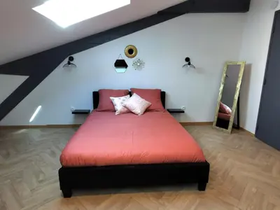 Un ou plusieurs lits dans un hébergement de l'établissement Nuit Tendance Mâcon - Chambre cosy centre ville E