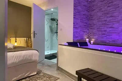 Un ou plusieurs lits dans un hébergement de l'établissement Appart&Spa Devosge
