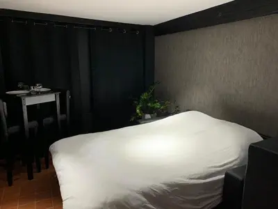 Un ou plusieurs lits dans un hébergement de l'établissement Studio au Moulin 