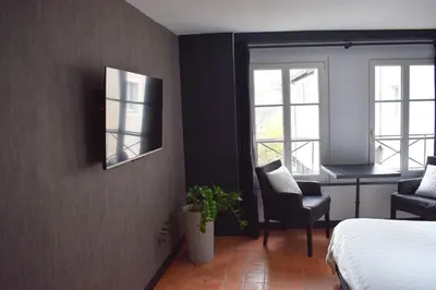 Un ou plusieurs lits dans un hébergement de l'établissement Studio au Moulin 