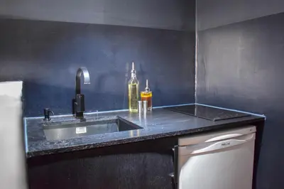 Cuisine ou kitchenette dans l'établissement Studio au Moulin 