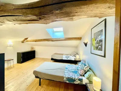 Un ou plusieurs lits dans un hébergement de l'établissement Domaine Joseph LAFARGE Wine Resort WineMaker House La maison du Vigneron