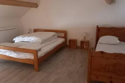 Un ou plusieurs lits dans un hébergement de l'établissement Petit gîte rural - la Forge -