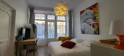Un ou plusieurs lits dans un hébergement de l'établissement Chambre de charme à Saulieu