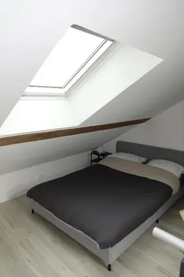 Un ou plusieurs lits dans un hébergement de l'établissement Dijon : Superbe appartement hyper centre en duplex