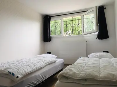Un ou plusieurs lits dans un hébergement de l'établissement Les Hauts de Fixin, 50m2 avec extérieur sur la Route des Grands Crus, Dijon Sud