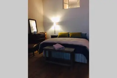 Un ou plusieurs lits dans un hébergement de l'établissement Chez Angèle Centre Mâcon appartement chaleureux