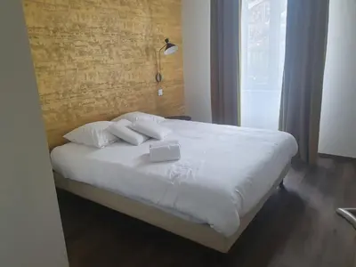 Un ou plusieurs lits dans un hébergement de l'établissement Legend Majestic - 3 chambres - Parking privé GRATUIT - Centre Ville - Quai de Saône - Gare - fibre
