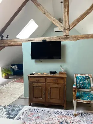 Télévision ou salle de divertissement dans l'établissement Maison Tassigny
