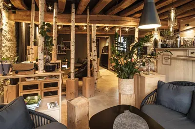 Coin salon dans l'établissement Le Studio des Prés Verts Suite Design avec Jacuzzi Privatif