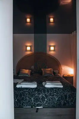 Un ou plusieurs lits dans un hébergement de l'établissement La Ronde des Bois - Romance et Bien Être - Jacuzzi privatif-piscine-patio