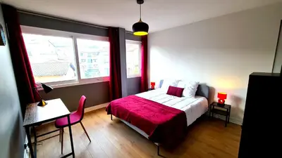 Un ou plusieurs lits dans un hébergement de l'établissement Appartement Mâcon Centre T4 - 100m2