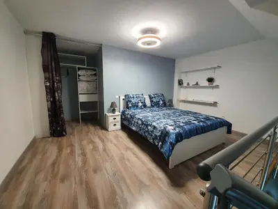Un ou plusieurs lits dans un hébergement de l'établissement Nuits & Jours Duplex à Nuits Saint Georges
