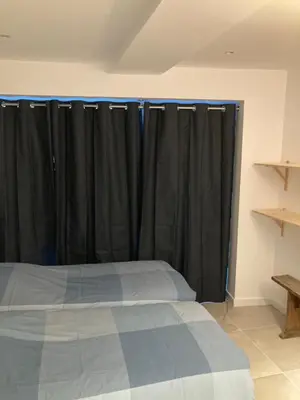 Un ou plusieurs lits dans un hébergement de l'établissement Appart' Au Coeur de Nuits