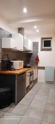 Cuisine ou kitchenette dans l'établissement superbe appartement de 40m2 avec parking gratuit sur place