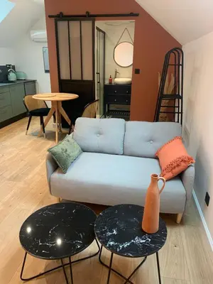 Coin salon dans l'établissement Le studio d’Ambre