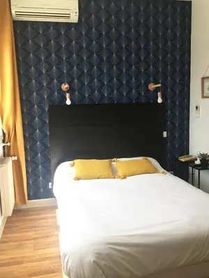 Un ou plusieurs lits dans un hébergement de l'établissement Brit Hotel Dijon Centre Gare