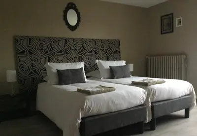 Un ou plusieurs lits dans un hébergement de l'établissement Chambres d'hôtes La Maison d'Après