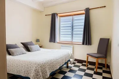 Un ou plusieurs lits dans un hébergement de l'établissement Gîte du Manoir