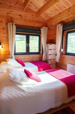 Un ou plusieurs lits dans un hébergement de l'établissement Le Chalet du Crescent