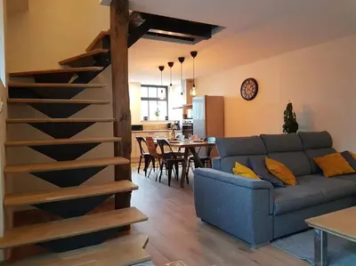 Coin salon dans l'établissement Gite du Cours St Mauris Authentique et moderne