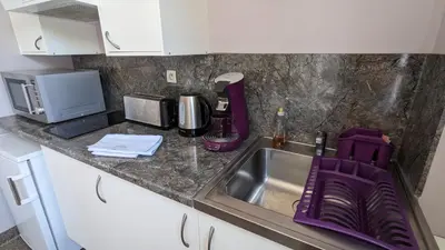 Cuisine ou kitchenette dans l'établissement Les gîtes de Cour Rémond